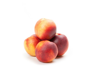 Ripe peaches fruits isolated on white