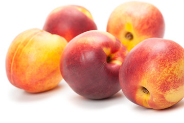 Ripe peaches fruits isolated on white