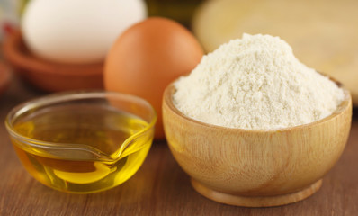 Fototapeta na wymiar Flour with eggs and cooking oil