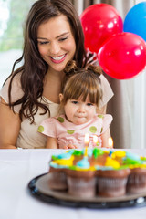 Obraz na płótnie Canvas Mother With Daughter Celebrating Birthday Party