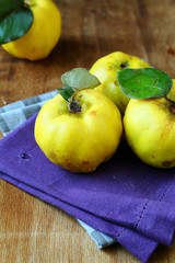Natural ripe quince on the wooden table