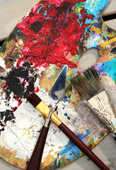 Art palette and mix of paintbrushes