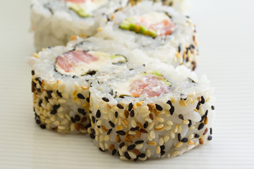 Sushi roll with tuna and sesame