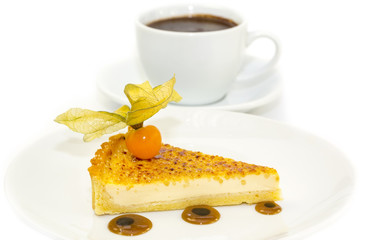 piece of cake with passion fruit and a cup of hot chocolate