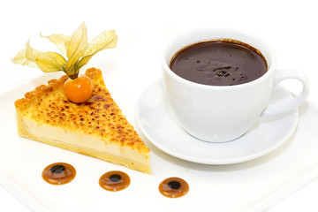 piece of cake with passion fruit and a cup of hot chocolate