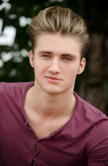 Handsome blond young man head-shot outside