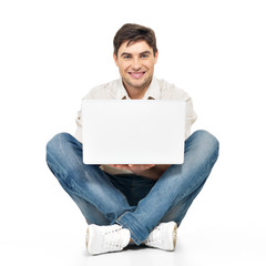 Portrait of  happy man working on laptop