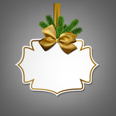 White paper gift card with golden satin bow.