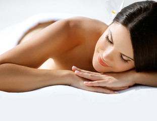 Spa Massage. Beautiful Young Woman Relaxing after Massage.