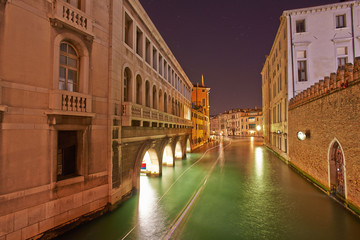 Fototapeta na wymiar Venice Long exposure By Night. Blurred motion on sea movement.