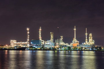 oil industry with river night light