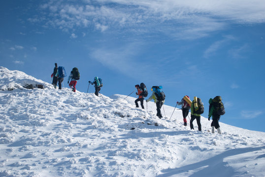 hikers in a winter mountain