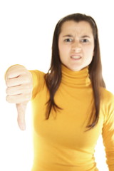 Close-up of a young woman showing thumbs down
