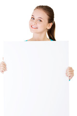 Attractive woman holding a poster with copy space.