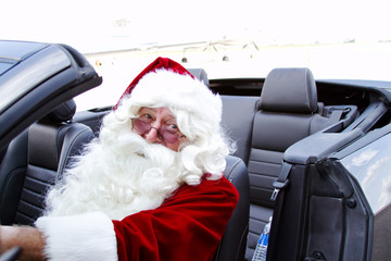 Santa in blue convertible