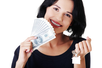 Attractive girl with money and house on hands.