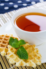 Tea with waffle and mint on Bamboo place mat