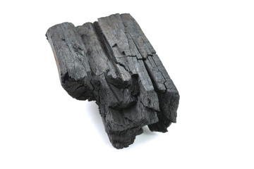 Piece of fractured wood coal on white background