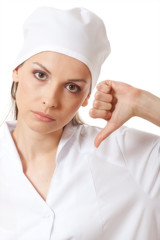 female doctor showing thumbs down gesture