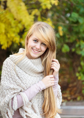 Girl with long blond hair outdoors