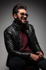 Fototapeta premium young fashion man with long beard laughing while looking away
