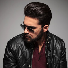profile of a young man in sunglasses and leather jacket