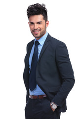 relaxed young business man smiling at the camera