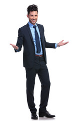 full body picture of a young business man welcoming