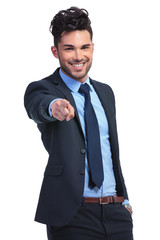 portrait of a relaxed young business man pointing