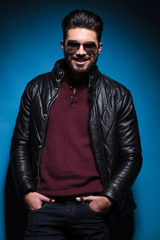 Fototapeta premium man in leather jacket is laughing for the camera
