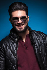 Obraz premium confident young man with long beard smiling