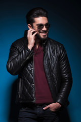 Obraz premium young man is laughing and scratching his beard