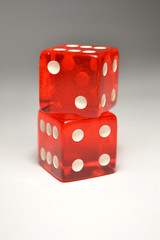Two Red Dice on top of another