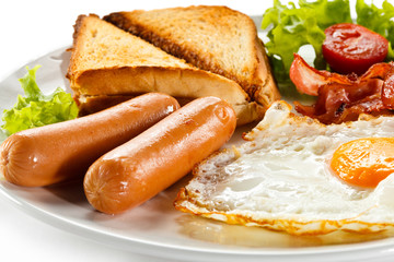 English breakfast - toast, egg, bacon and vegetables