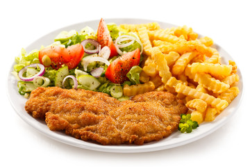 Fototapeta premium Pork chop, French fries and vegetables