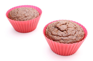Fresh baked chocolate muffin in red silicone cups