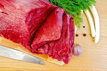 Meat beef on a board with garlic