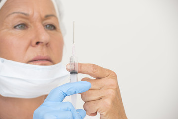 Nurse with Flu vaccination in injection