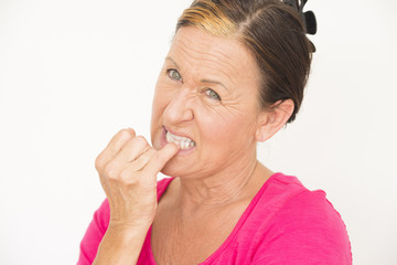 Nervous worried woman biting finger