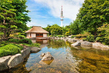 Japanese Garden with Heinrich-Hertz tower in Hamburg, Germany - obrazy, fototapety, plakaty