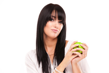 beautiful brunette woman with green apple on white background