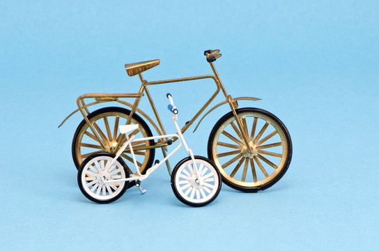 two  bicycle model toy on blue background