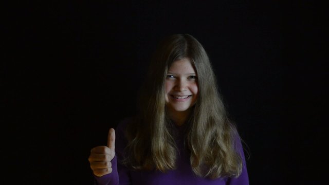 Girl thumbs up