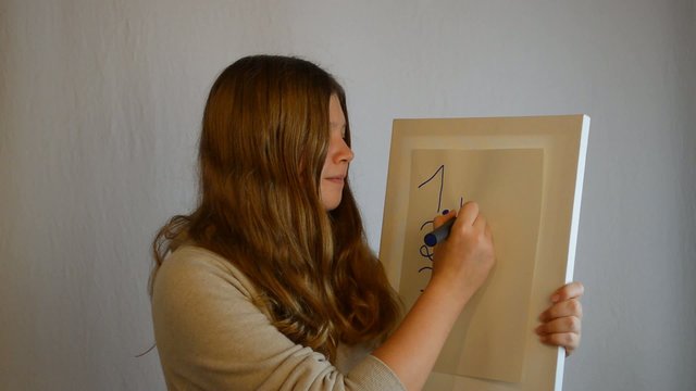 Girl with board checking numbers
