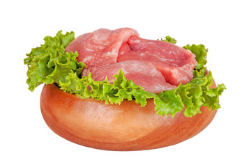Fresh raw pork meat and salad isolated on white