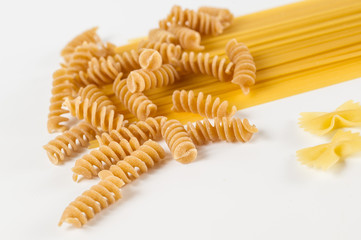 mixed italian pasta in white background