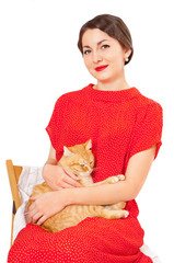 Beautiful woman in red dress with a cat