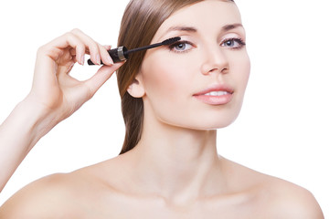 attractive woman and mascara brush