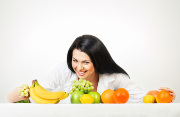 brunette woman with fruits