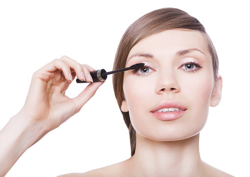 attractive woman with mascara brush